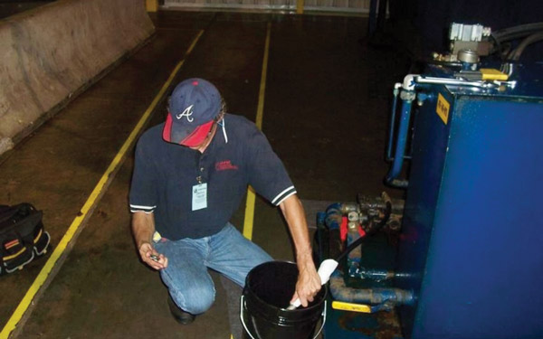  Figure 2. Check oil flow by porting the case drain line into a container of a known size and timing the flow rate.