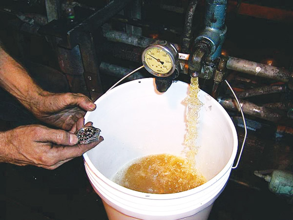 Test a fixed-displacement pump by turning on the pump and recording the flow out of the relief valve tank line for one minute.
